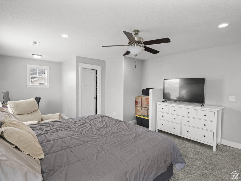 Bedroom featuring ceiling fan, visible vents, baseboards, carpet floors, and recessed lighting