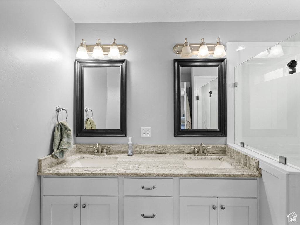 Full bathroom with double vanity and a sink