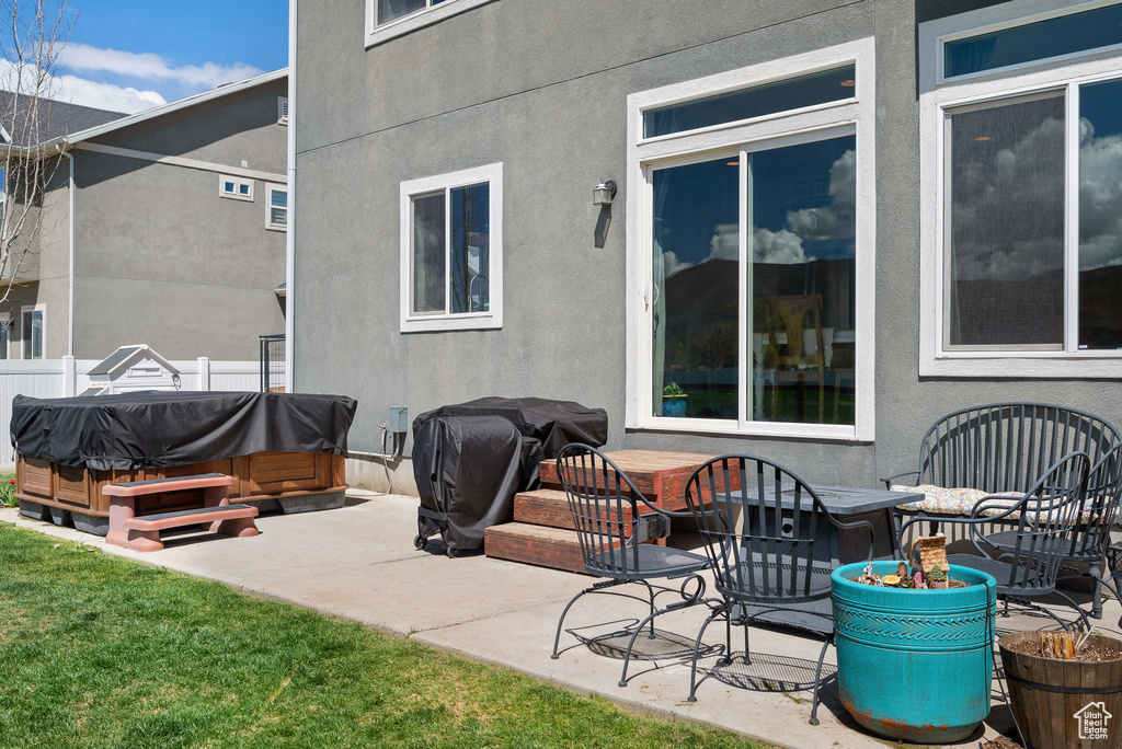 View of patio / terrace with a hot tub