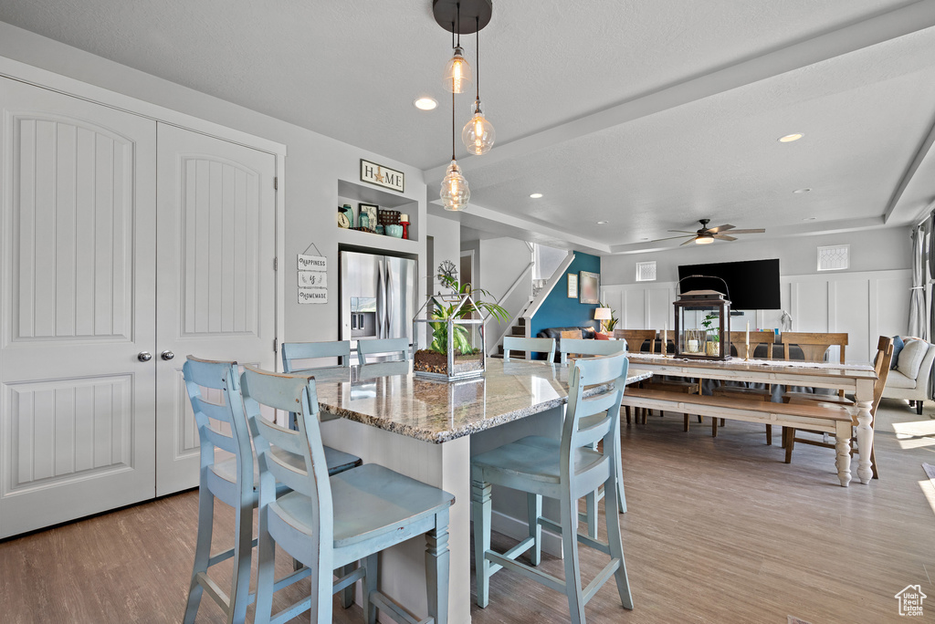 Dining area featuring stairs, a ceiling fan, recessed lighting, and light wood-type flooring