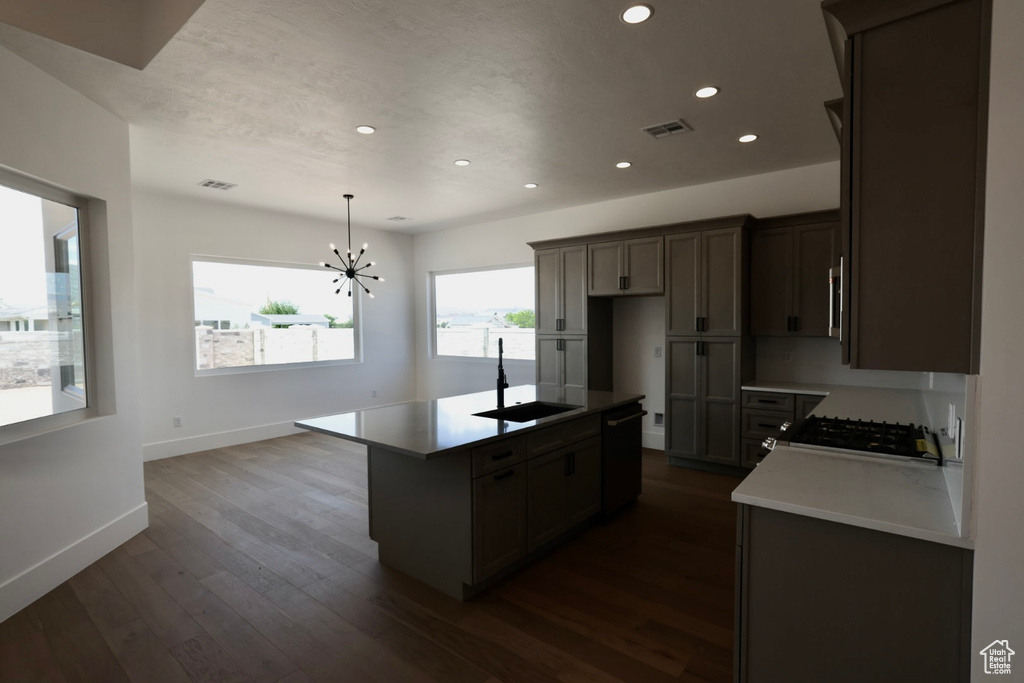 Kitchen featuring visible vents, a sink, baseboards, black dishwasher, and recessed lighting