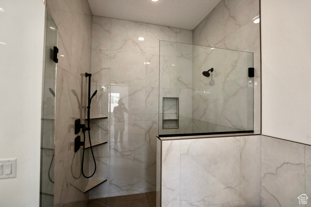 Bathroom with a marble finish shower