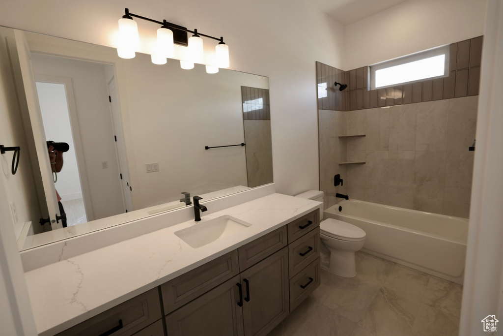 Full bath with toilet, bathtub / shower combination, and vanity