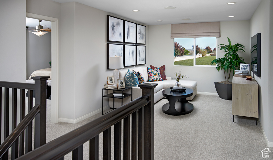 Living area featuring baseboards, recessed lighting, carpet, and ceiling fan