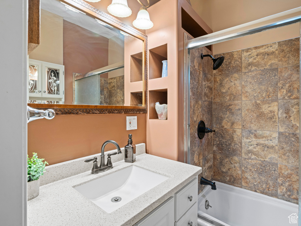 Full bathroom featuring vanity and  shower combination
