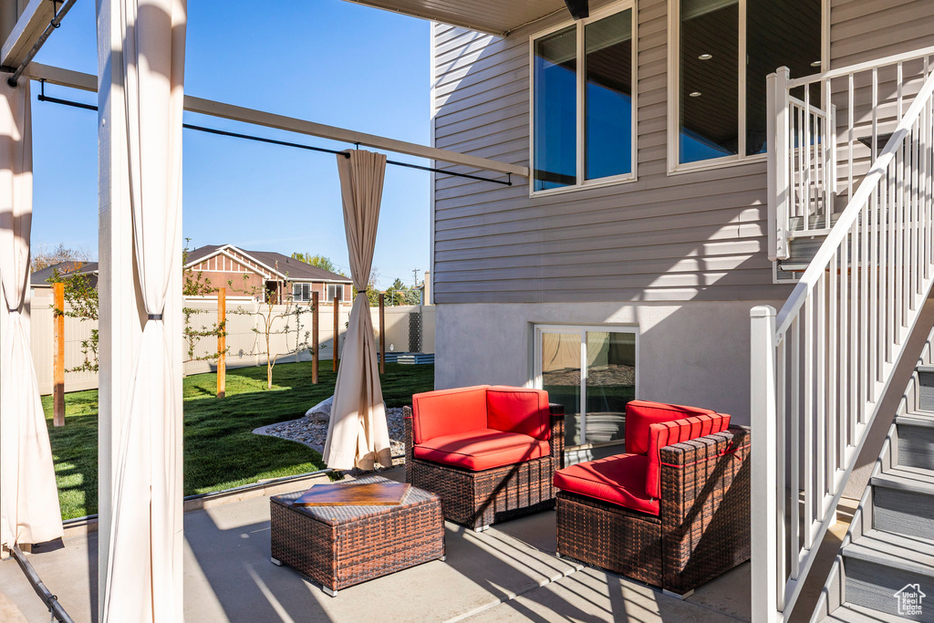 View of patio / terrace featuring an outdoor hangout area, stairs, and a fenced backyard
