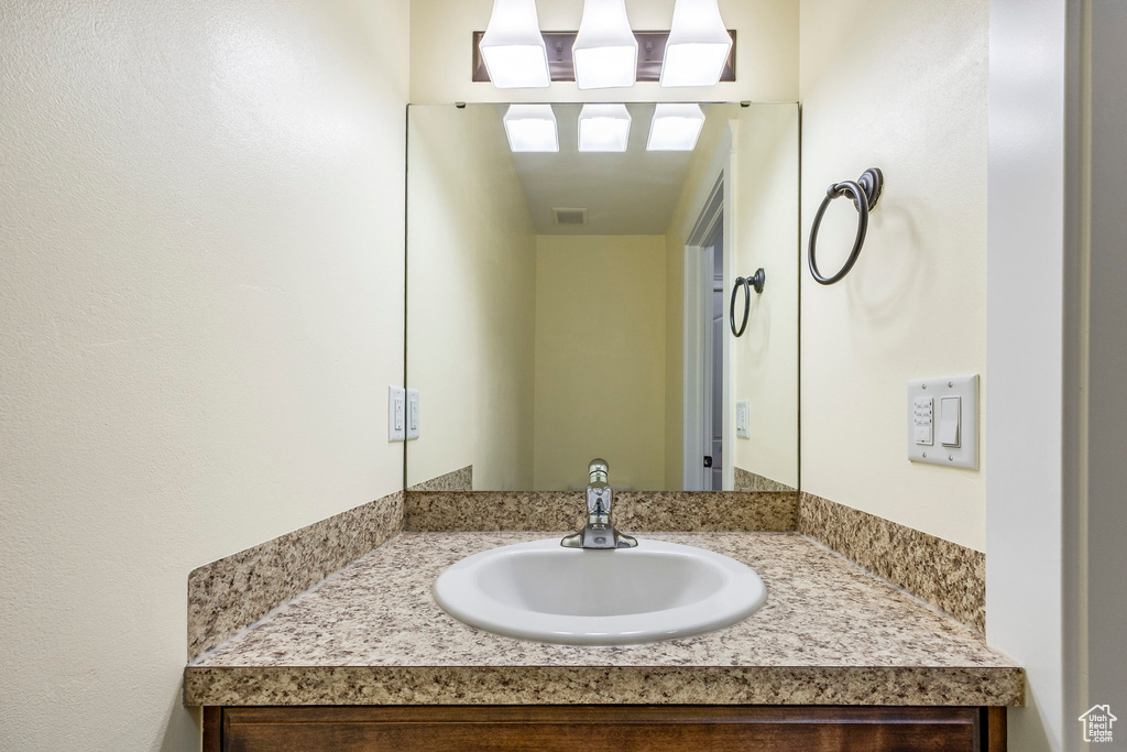 Bathroom featuring vanity and visible vents