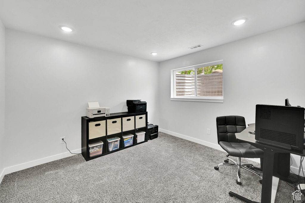 Carpeted office with baseboards, recessed lighting, and visible vents