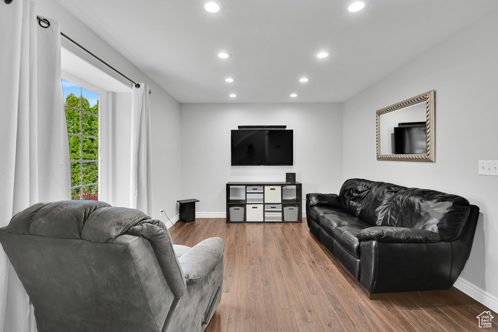 Living area featuring recessed lighting, baseboards, and wood finished floors