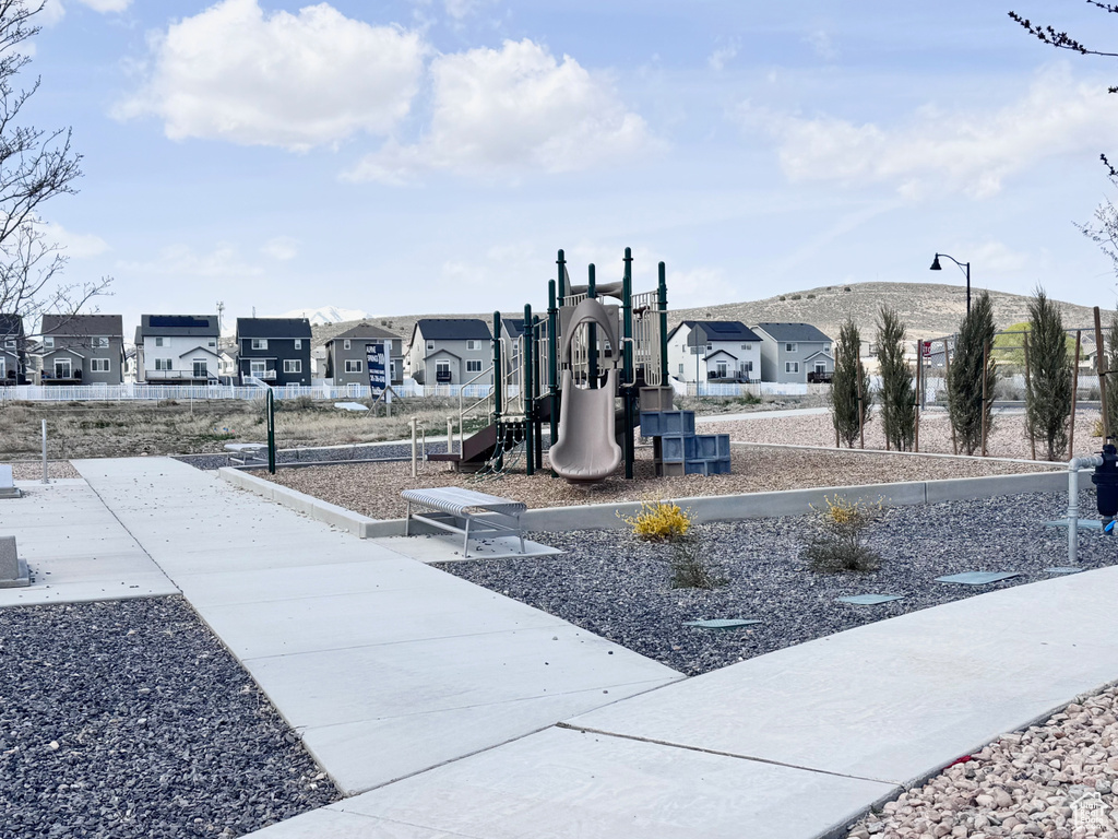 Community jungle gym featuring a residential view