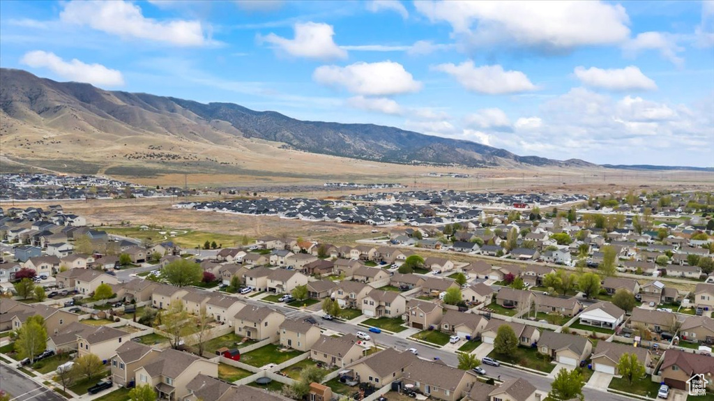 Drone / aerial view with a residential view and a mountain view