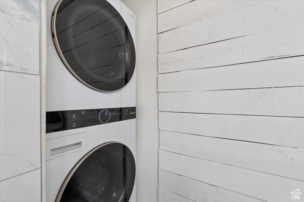 Laundry area featuring laundry area and stacked washing maching and dryer
