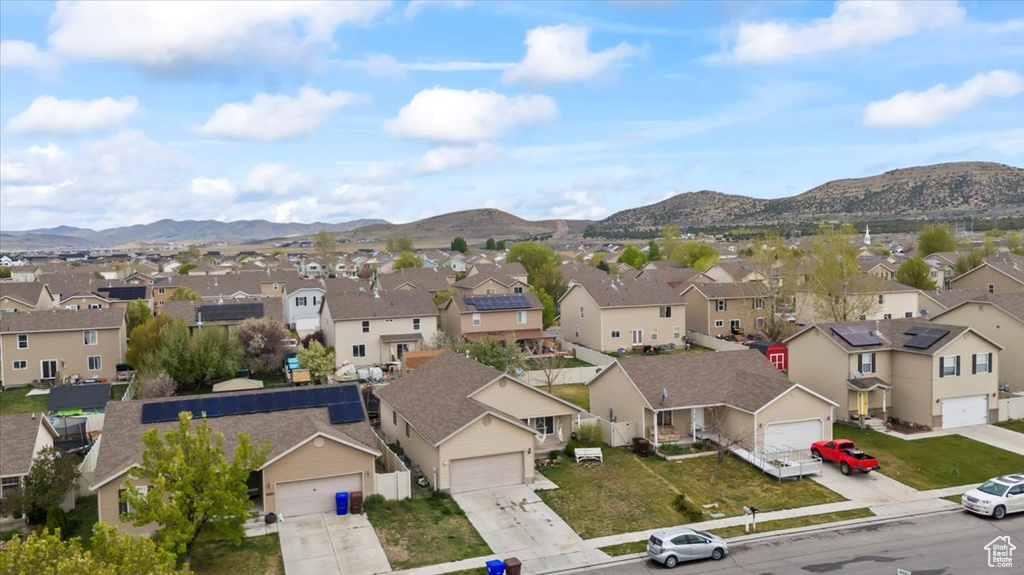 Drone / aerial view with a residential view and a mountain view
