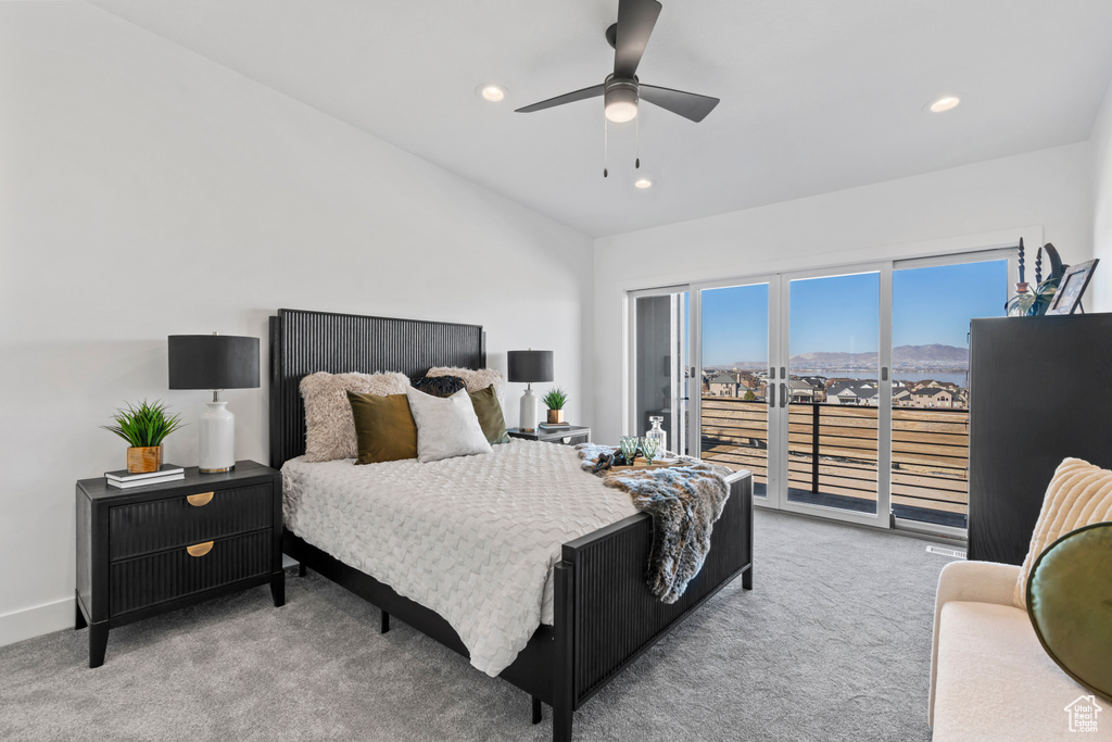 Carpeted bedroom with a mountain view, a ceiling fan, recessed lighting, and access to exterior