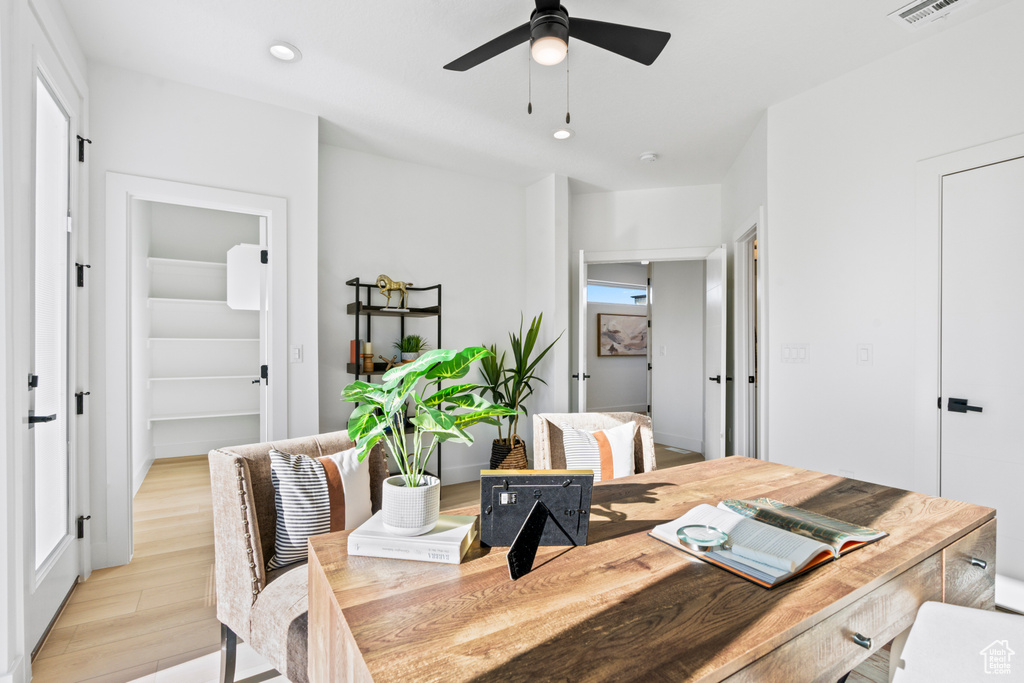 Dining space with light wood-type flooring, a ceiling fan, visible vents, and recessed lighting