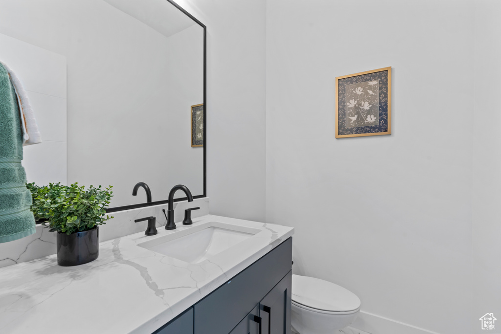 Bathroom with toilet and vanity