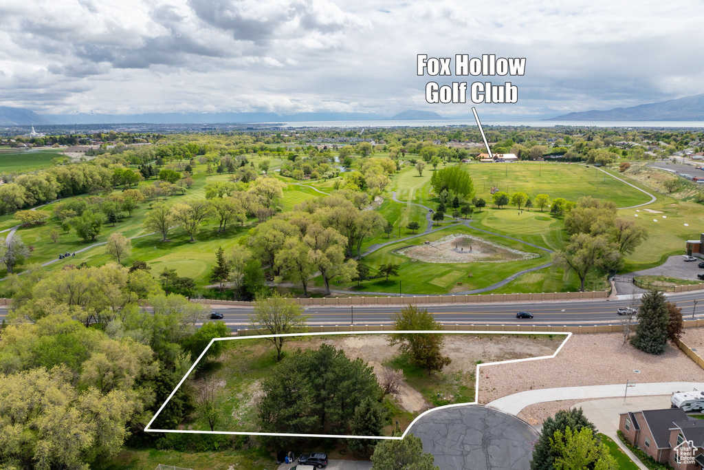 Aerial view featuring a mountain view and view of golf course