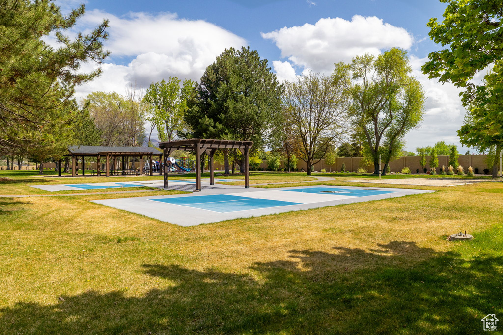 View of home\\\'s community with a gazebo, fence, and a yard