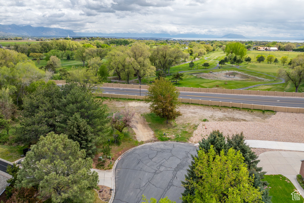 Birds eye view of property with a mountain view and golf course view
