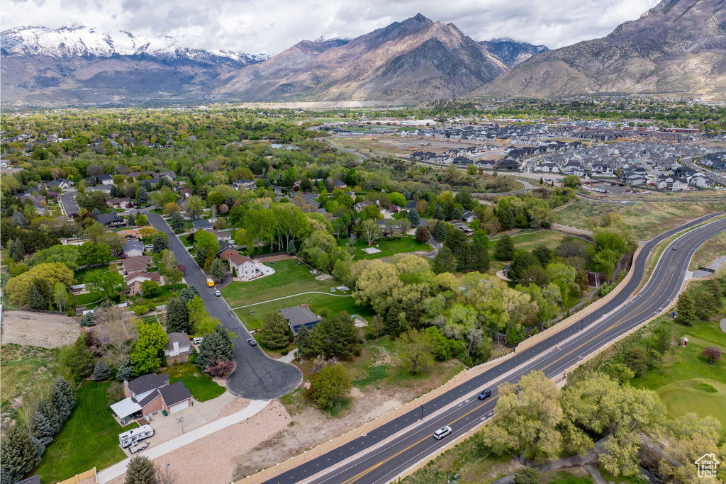 Birds eye view of property with a residential view and a mountain view
