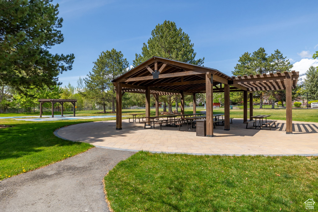 Surrounding community featuring a pergola, a gazebo, and a yard