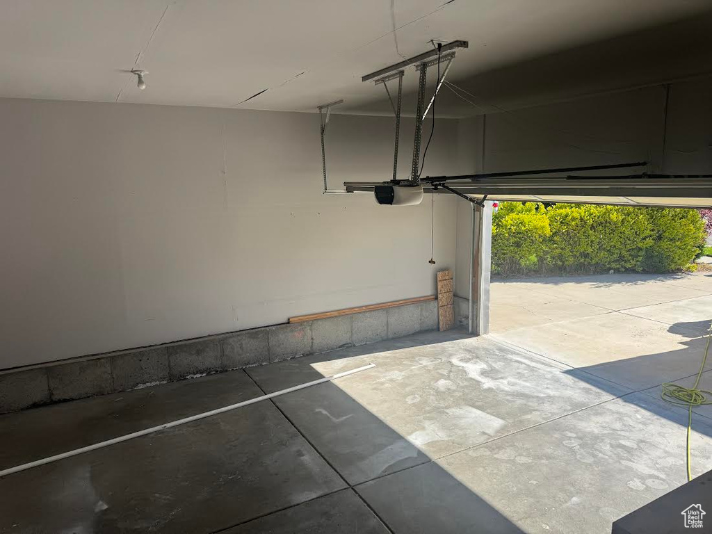Garage featuring a garage door opener