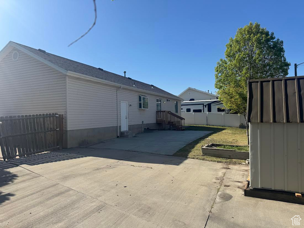 Rear view of property with fence