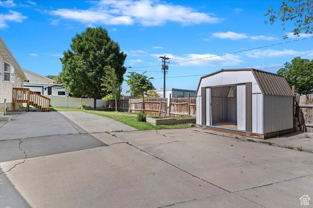 Fenced backyard featuring a patio