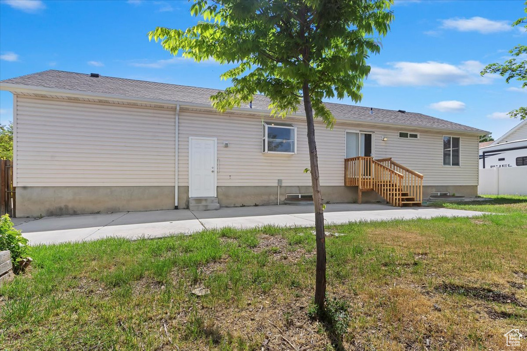 Back of house with a patio