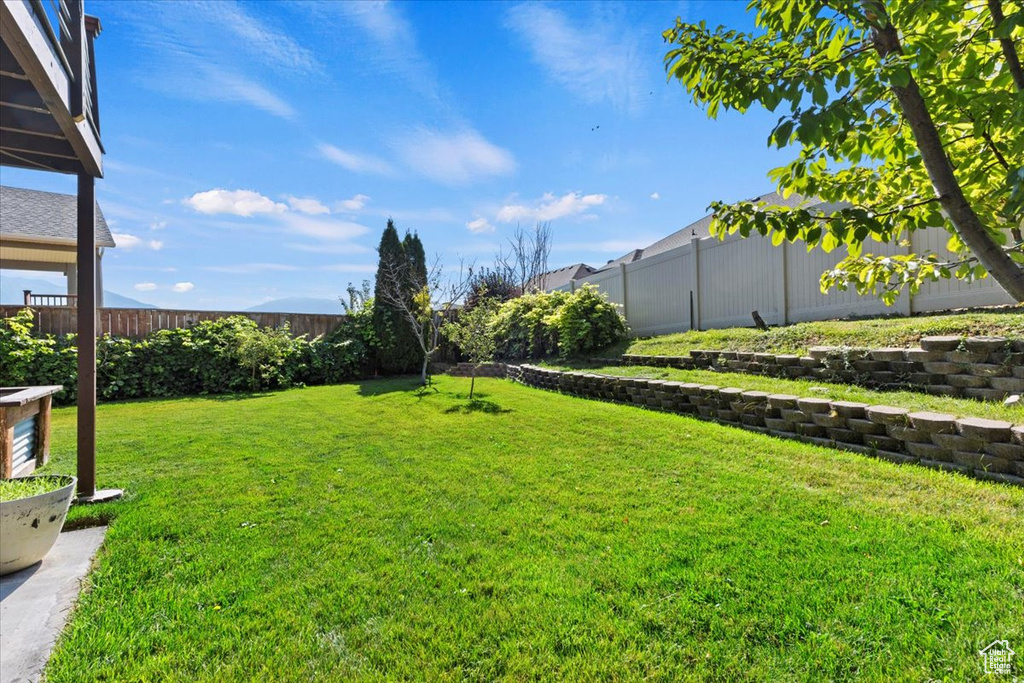View of yard with a fenced backyard