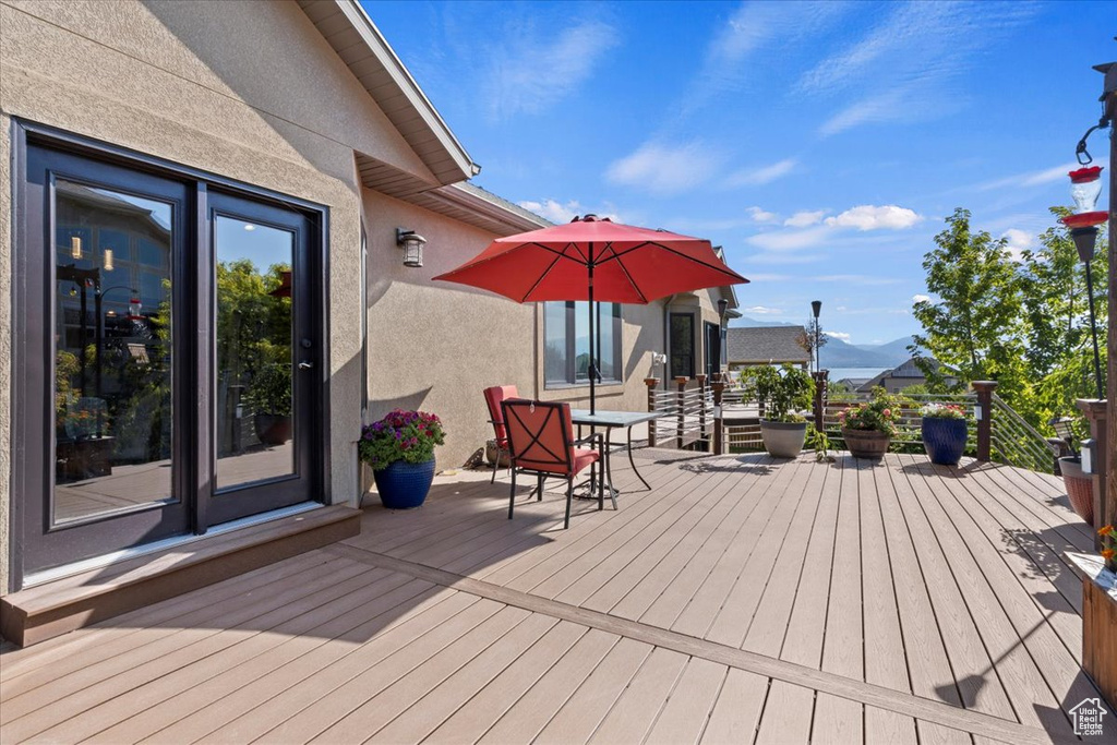 Wooden terrace featuring a mountain view