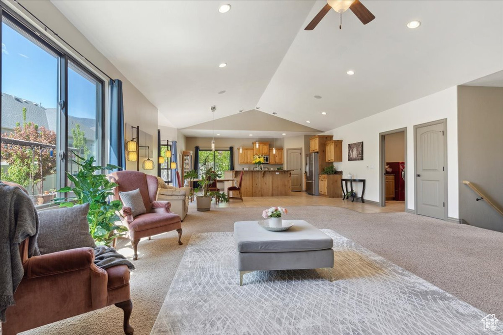 Living area featuring recessed lighting, ceiling fan, light carpet, and lofted ceiling