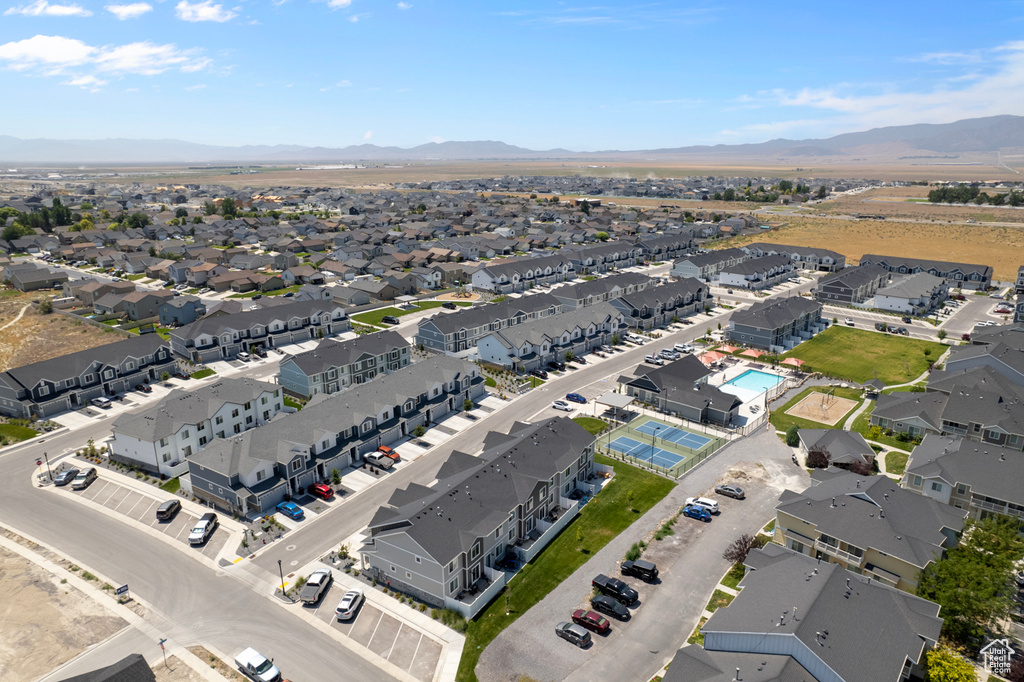 Birds eye view of property with a residential view and a mountain view