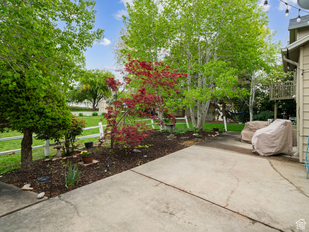 View of patio with fence