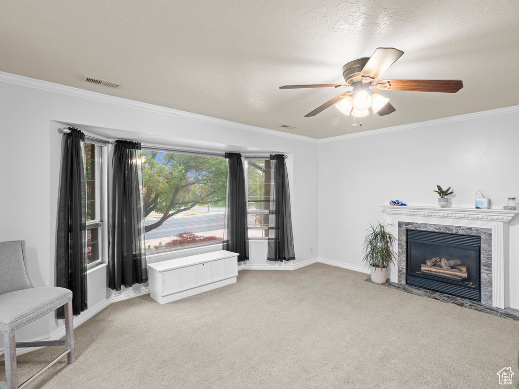 Unfurnished room with carpet flooring, ceiling fan, and crown molding