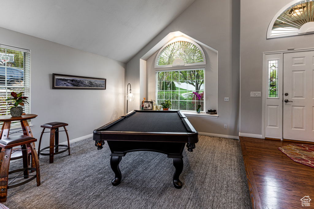 Playroom featuring pool table, baseboards, a wealth of natural light, and lofted ceiling