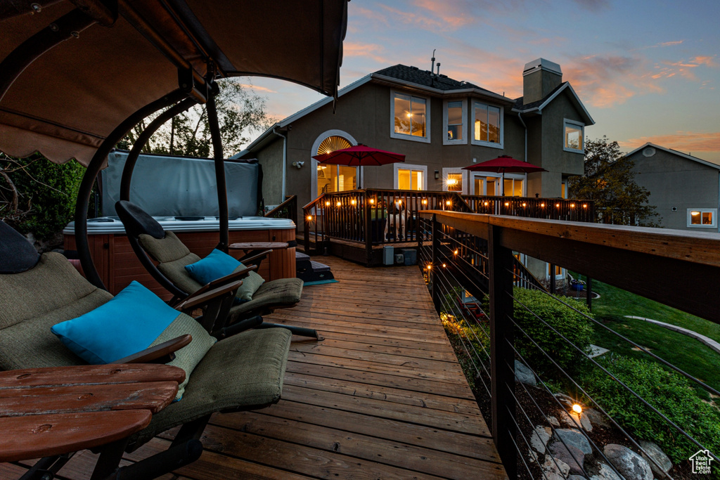 Wooden deck featuring a hot tub