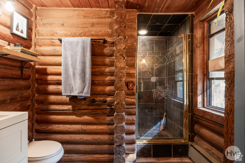 Full bath with toilet, rustic walls, a shower stall, and vanity