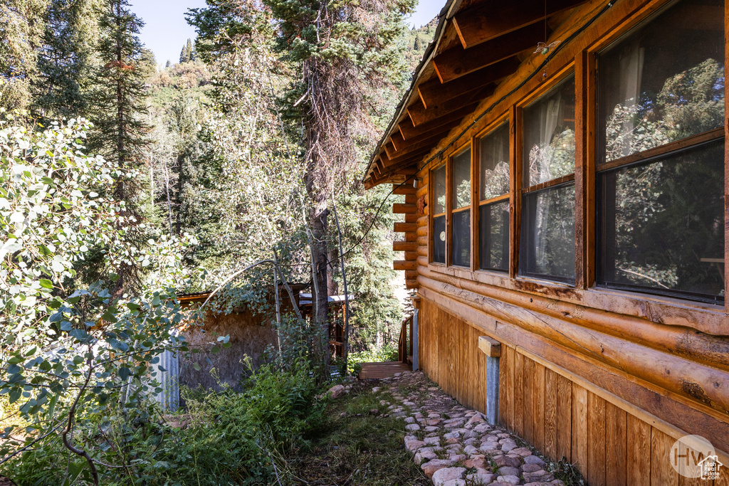 View of side of home featuring log siding