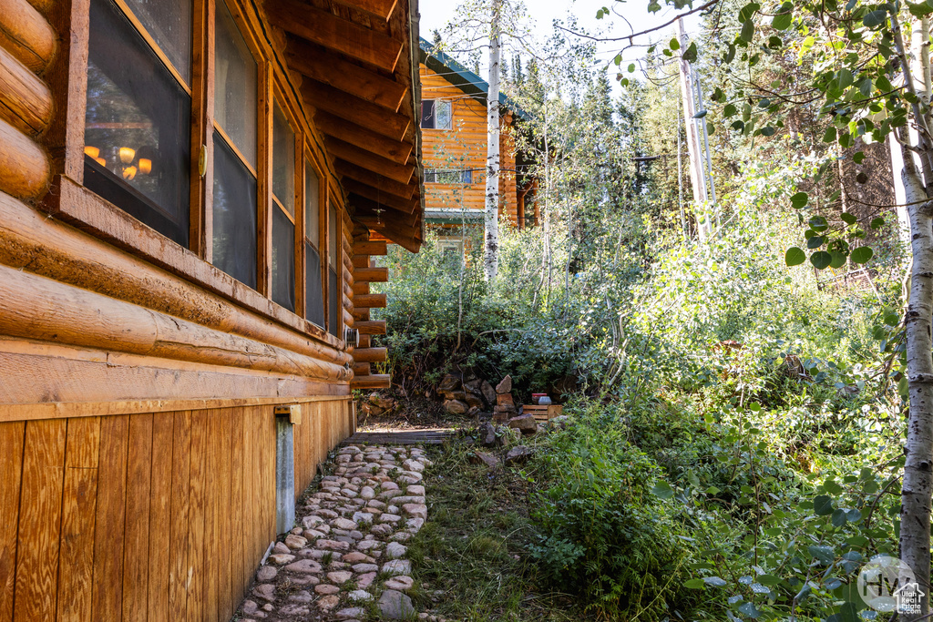 View of side of home with log siding