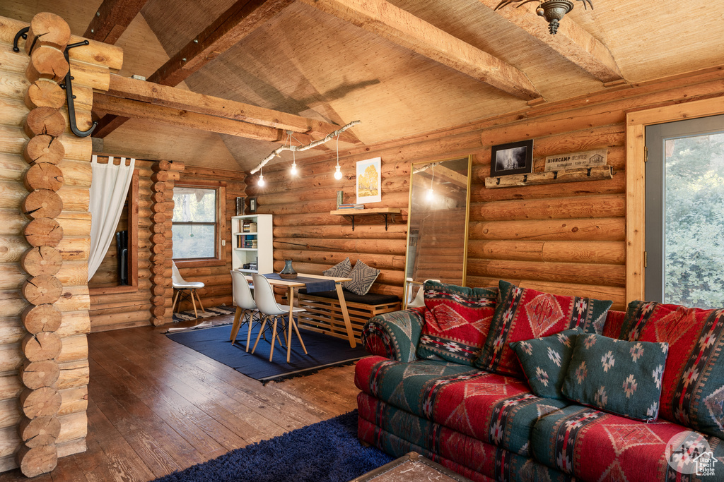 Living area featuring wooden ceiling, vaulted ceiling with beams, and hardwood / wood-style floors