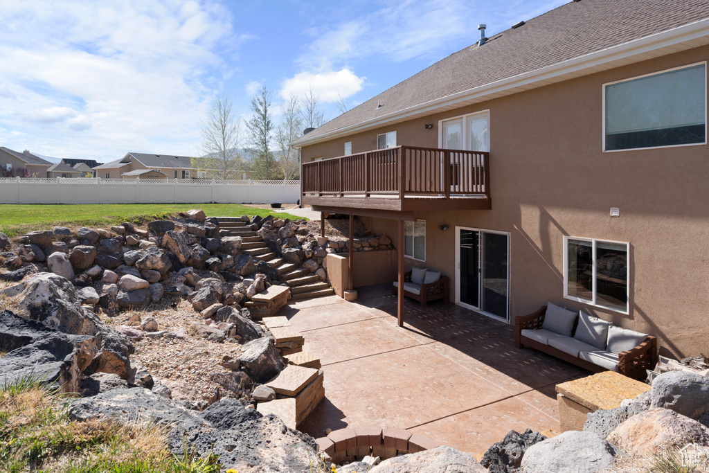 View of patio / terrace with stairway and fence