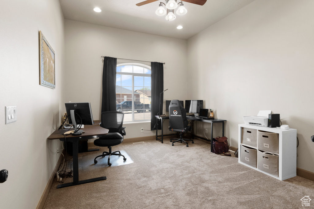 Carpeted office space with a ceiling fan, baseboards, and recessed lighting