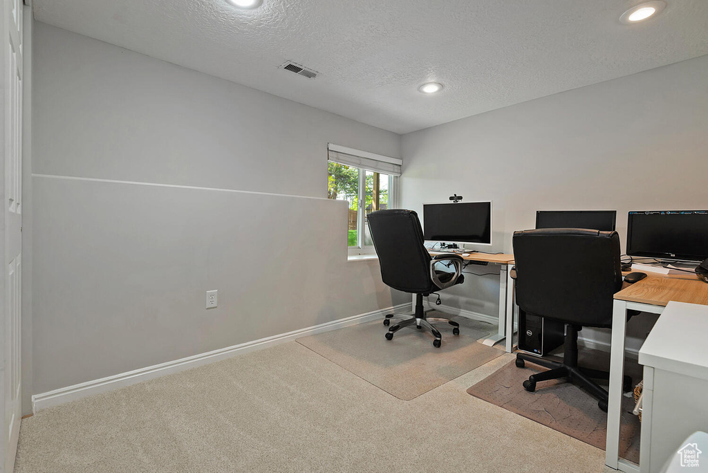 Carpeted home office with visible vents, recessed lighting, a textured ceiling, and baseboards