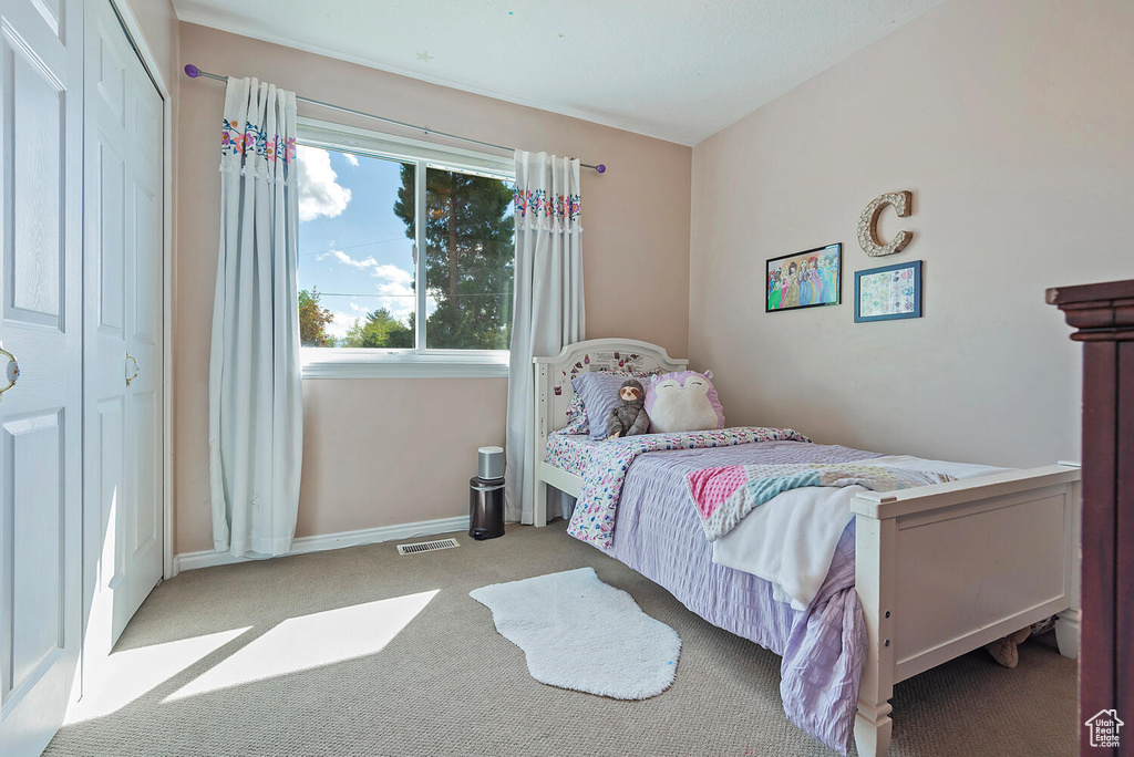Bedroom with carpet and visible vents