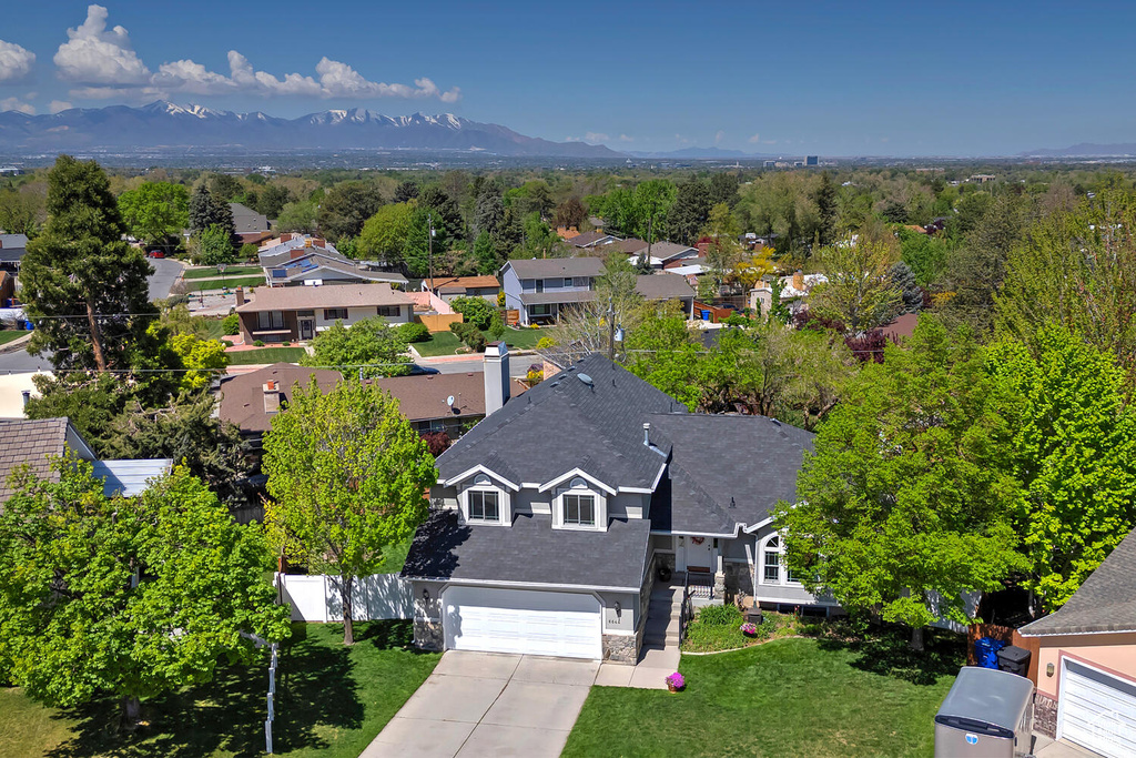 Drone / aerial view with a residential view and a mountain view