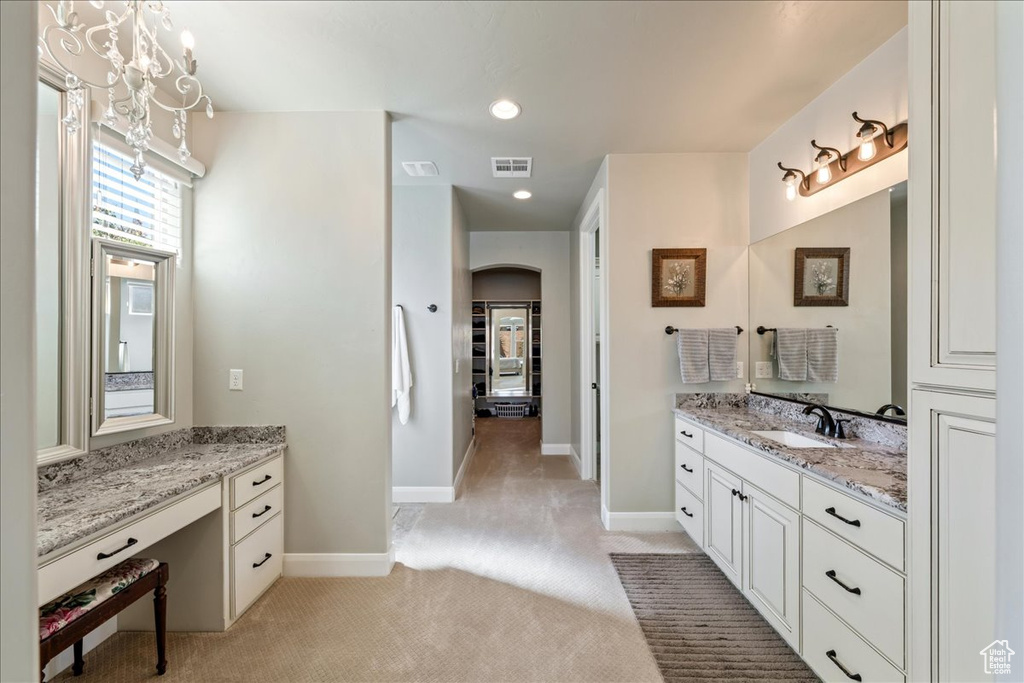 Bathroom with visible vents, recessed lighting, baseboards, and vanity