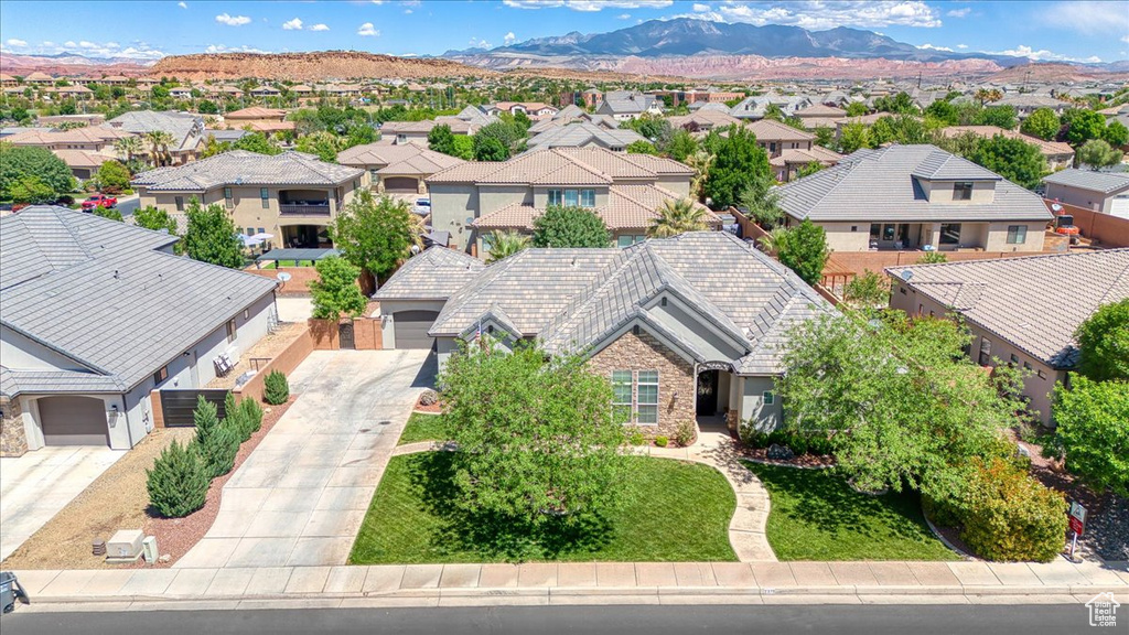 Drone / aerial view with a residential view and a mountain view