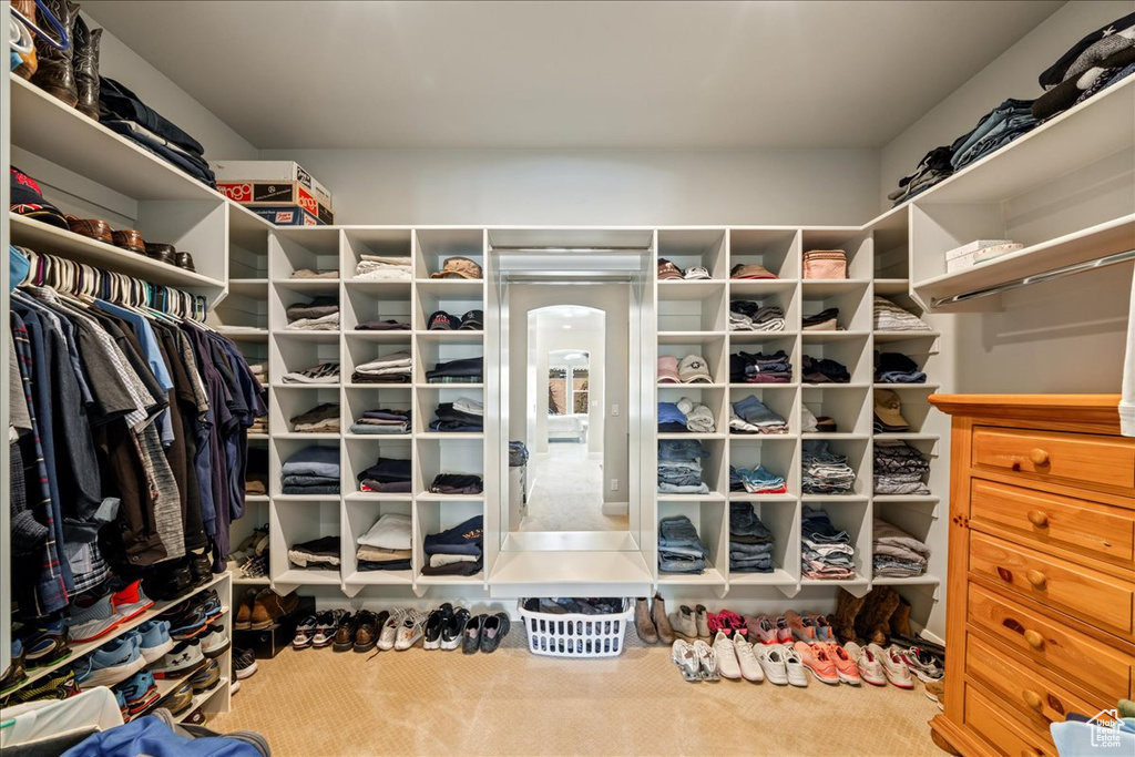 Walk in closet featuring carpet flooring