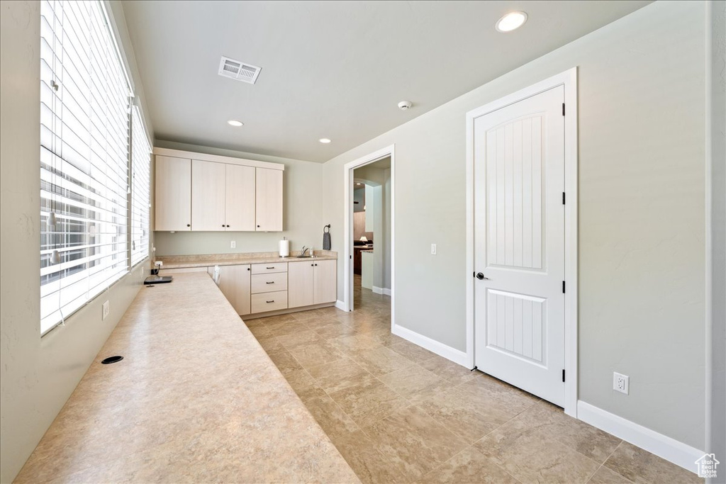 Washroom with recessed lighting, baseboards, and visible vents